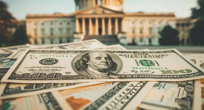 Cozy kitchen scene with a person reviewing payday loan documents on a laptop