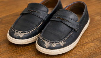 Pair of scuffed toddler loafers